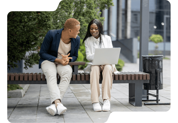 Two professionals discussing services outdoors, representing target customer personas