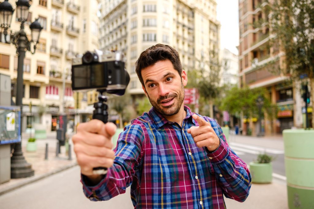 Man recording himself with a camera
