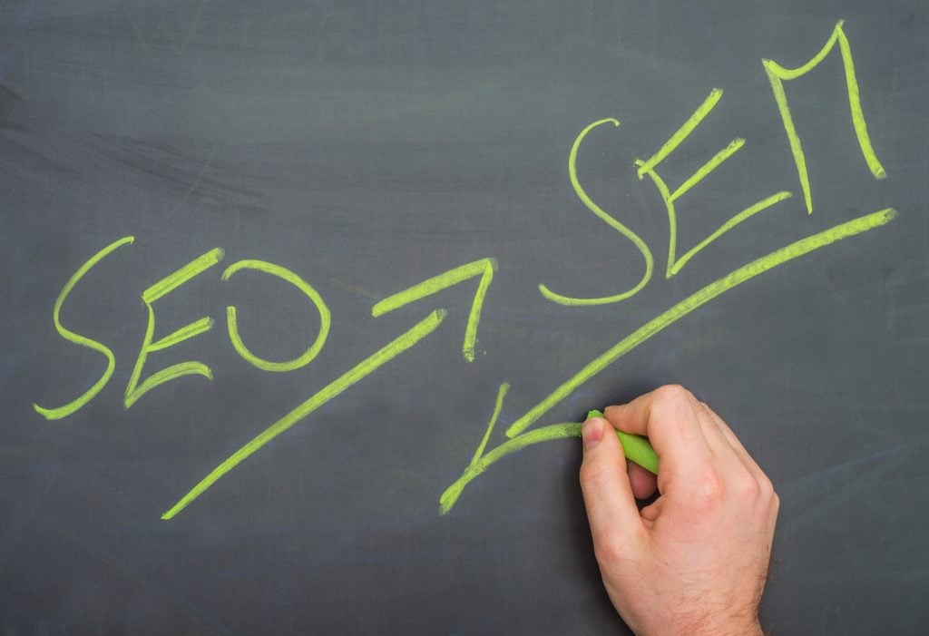 SEO and SEM written on a blackboard with chalk