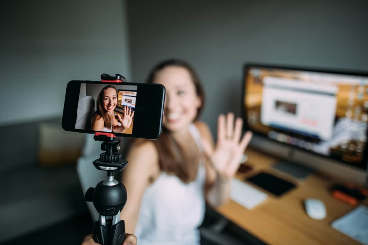 Woman vlogging at home utilizing influencer marketing