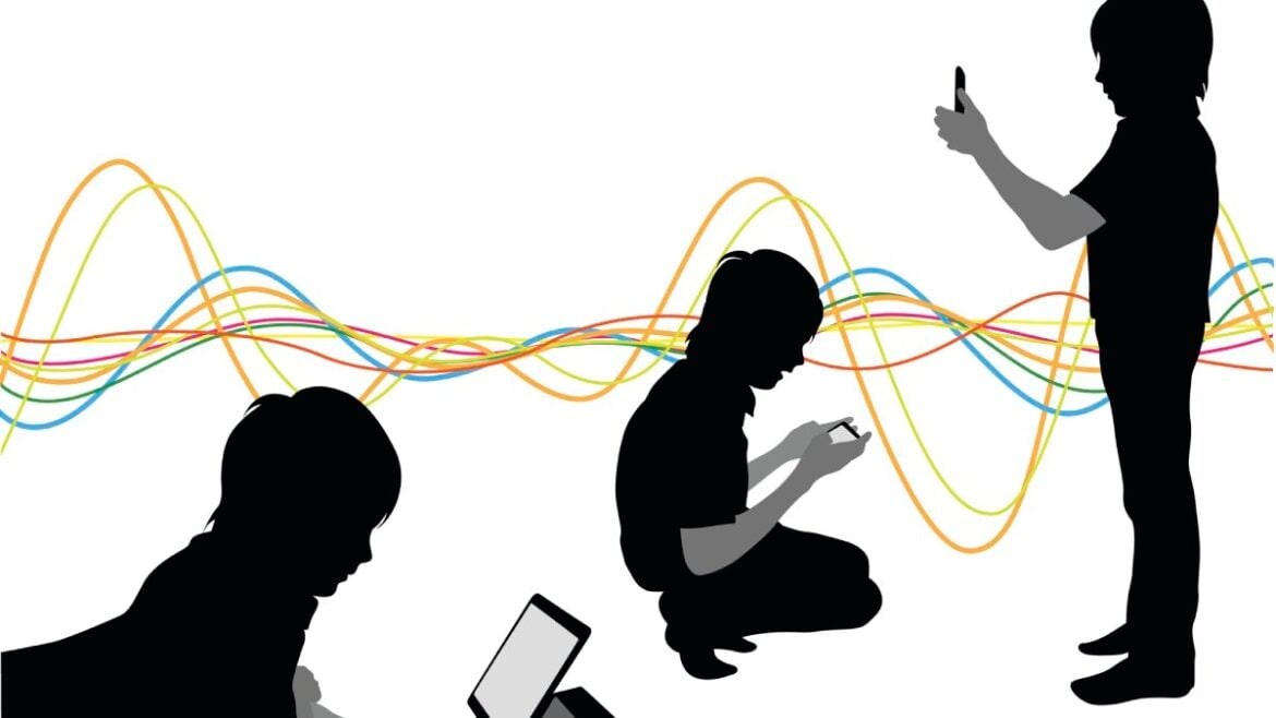 Silhouettes of children using digital devices, including a tablet and smartphone, with colourful data waveforms in the background representing Gen Alpha's tech-driven habits.