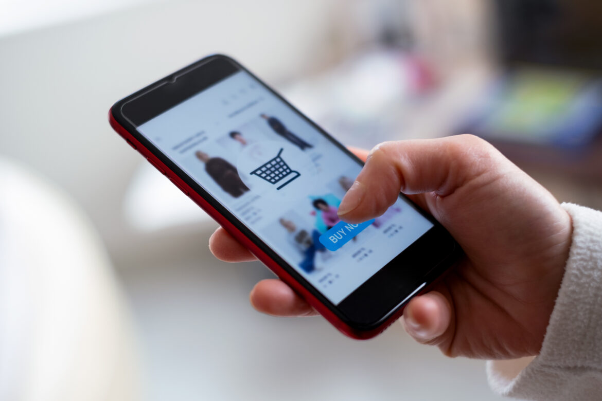 Woman shopping on an eCommerce website on her phone